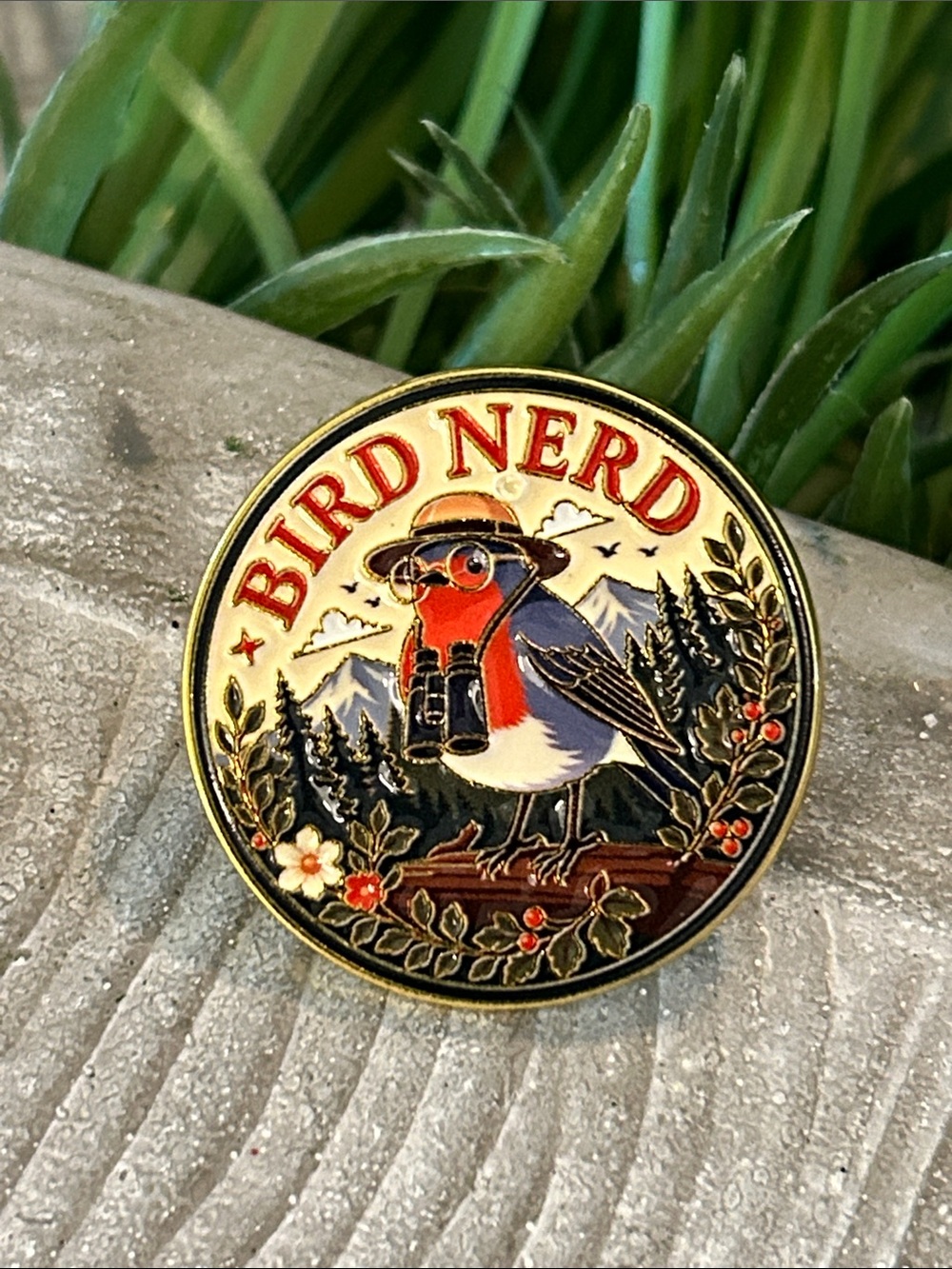 Bird Nerd Enamel Pin - Robin wearing binoculars in a garden forest scene